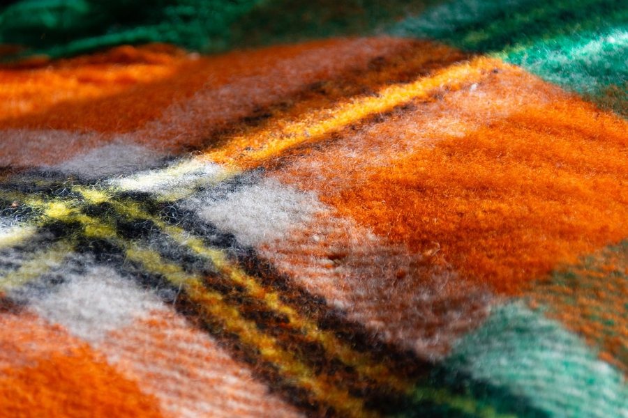 A close-up of a plaid wool fabric.