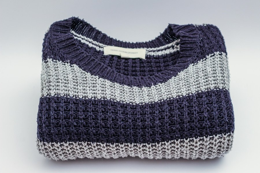A folded navy and cream striped knit.