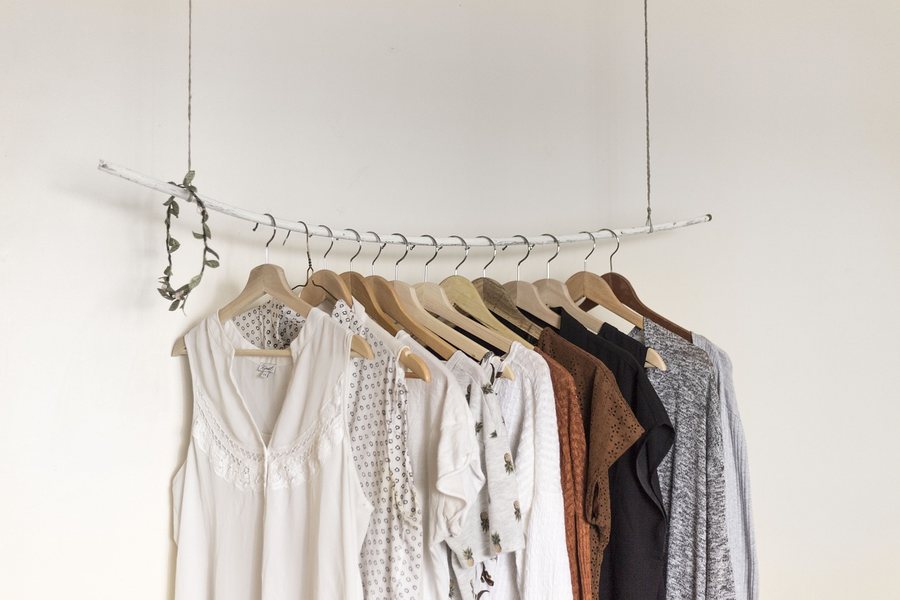Shirts hanging on a clothing rail.