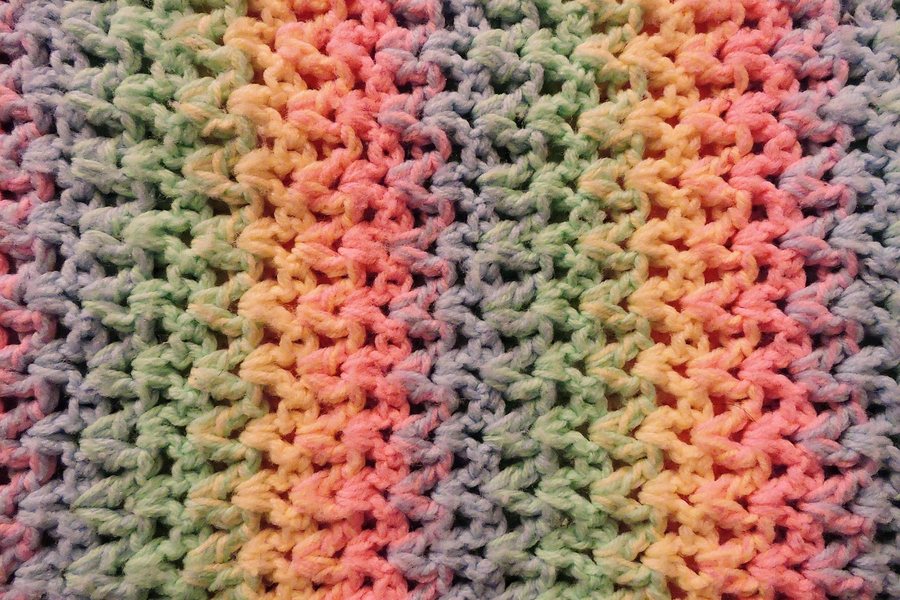 A close-up of a multicolour knit fabric.