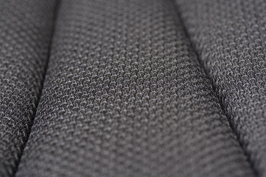 A close-up of a grey wool coating fabric.