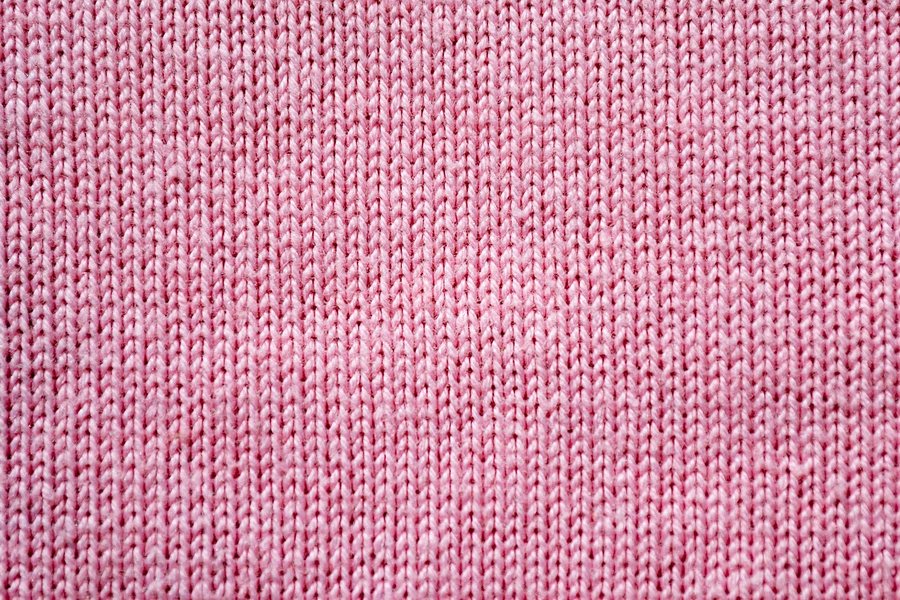 A close-up of a pink woven fabric.