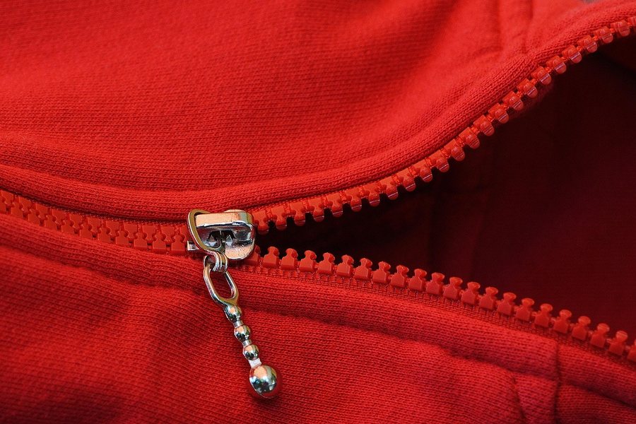 A red zip on a garment.