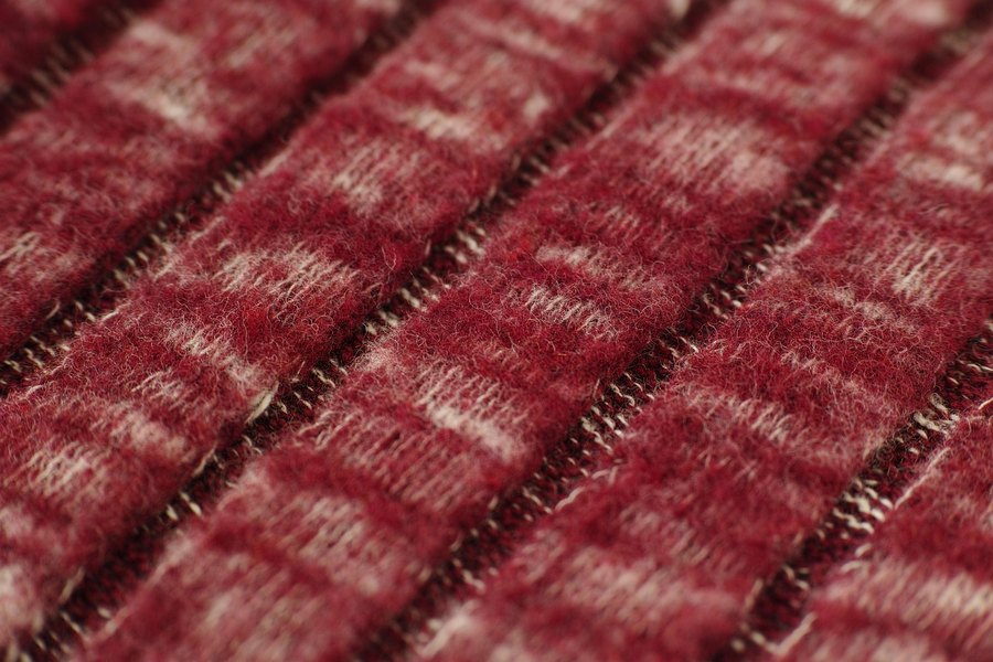 A close-up of a rust-coloured fabric.