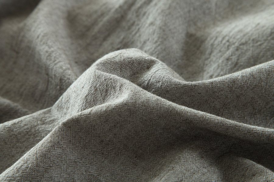 Folds of a white pleated fabric.