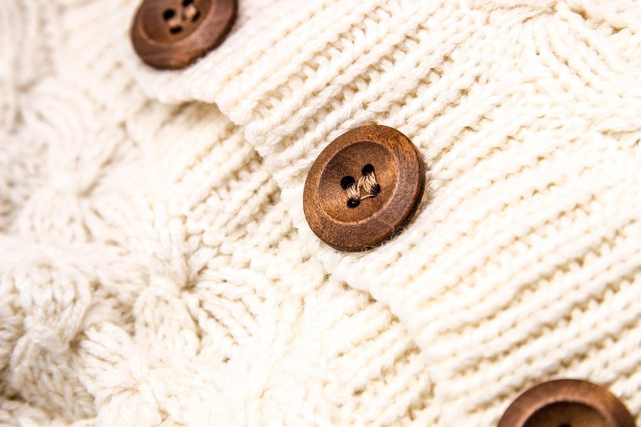 A white knit with buttons.