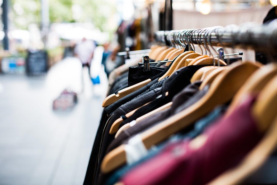 Garments hanging on a clothing rail.