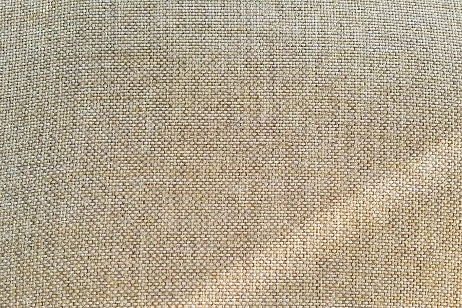 A close-up of a beige linen weave.
