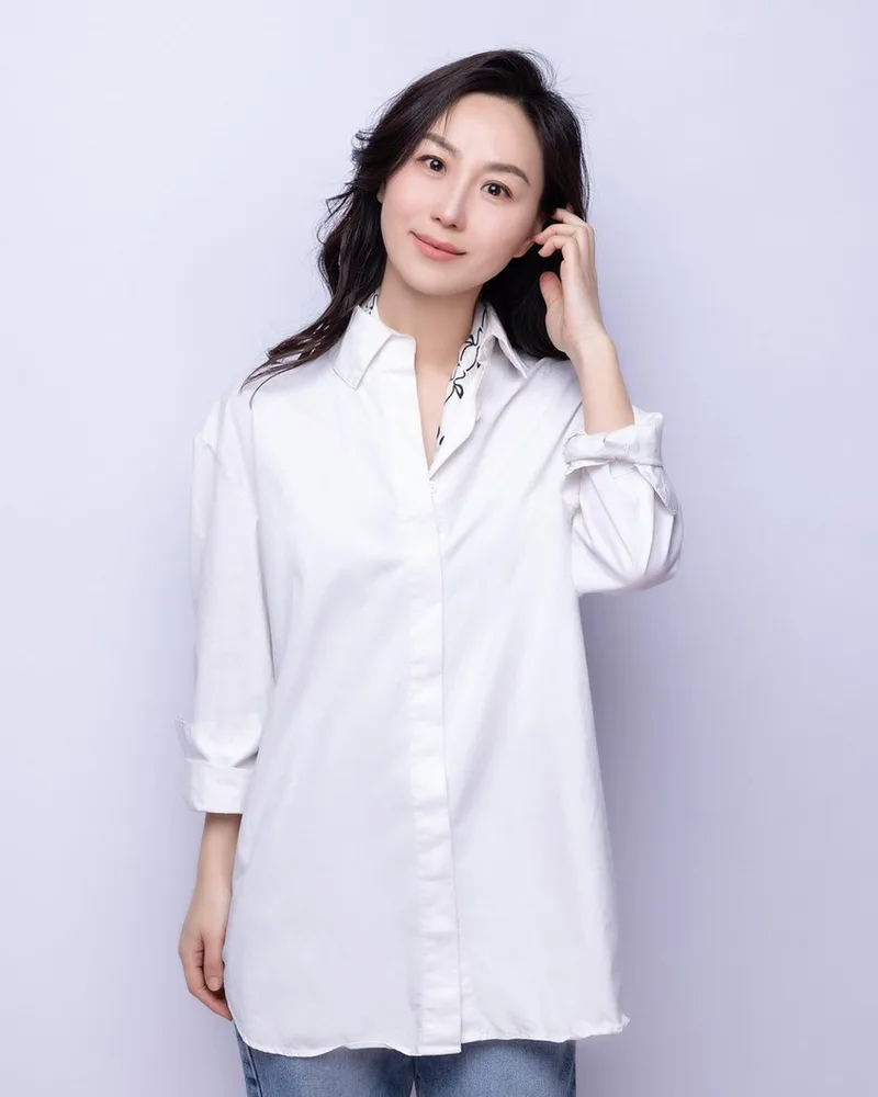 A white shirt photographed against a pale wall.