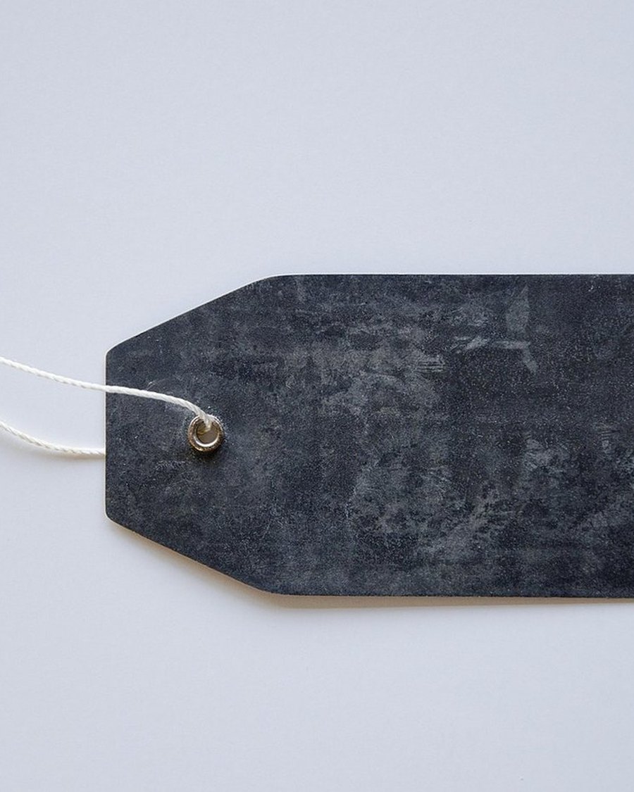 A black garment care tag.
